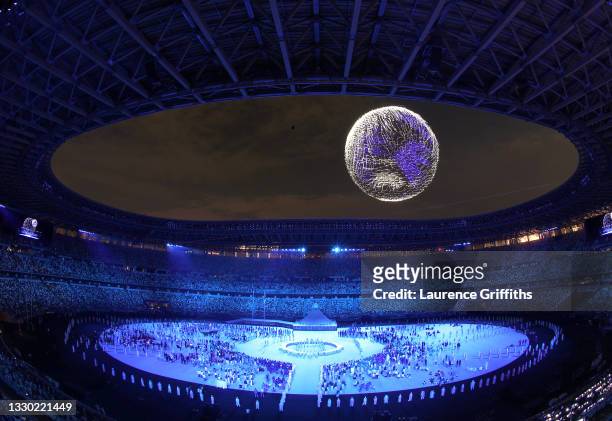 Drone display is seen over the top of the stadium during the Opening Ceremony of the Tokyo 2020 Olympic Games at Olympic Stadium on July 23, 2021 in...