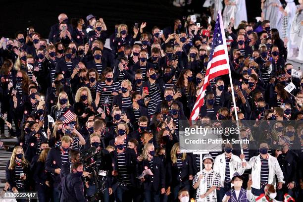 Flag bearers Sue Bird and Eddy Alvarez of Team United States lead their team during the Opening Ceremony of the Tokyo 2020 Olympic Games at Olympic...