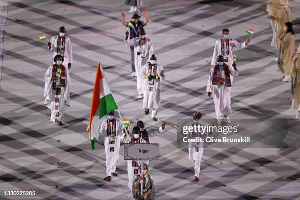 Flag bearers Roukaya Moussa Mahamane and Abdoul Razak Issoufou Alfaga of Team Niger during the Opening Ceremony of the Tokyo 2020 Olympic Games at...