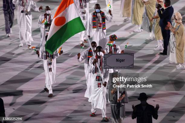 Flag bearers Roukaya Moussa Mahamane and Abdoul Razak Issoufou Alfaga of Team Niger during the Opening Ceremony of the Tokyo 2020 Olympic Games at...