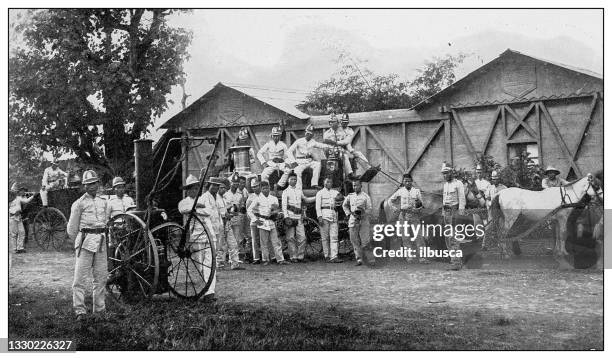 stockillustraties, clipart, cartoons en iconen met antique black and white photograph: bamberos or manila fire company, philippines - old manila