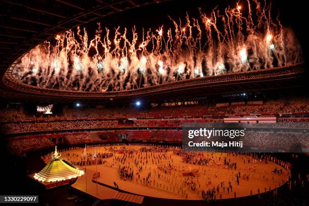 General view inside the stadium as Naomi Osaka of Team Japan lights the Olympic cauldron with the Olympic torch during the Opening Ceremony of the...