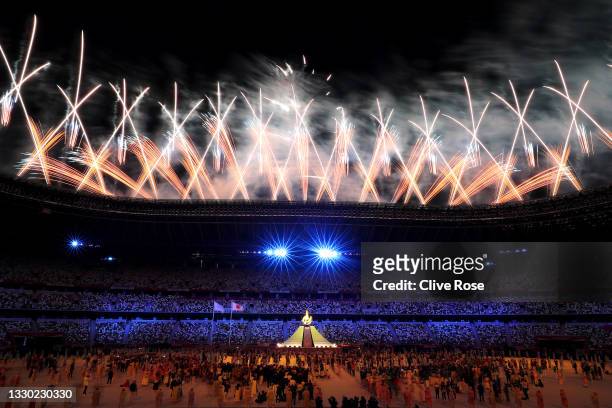 General view inside the stadium as fireworks go off as the Olympic cauldron is lit during the Opening Ceremony of the Tokyo 2020 Olympic Games at...