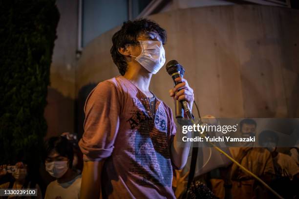 An anti-Olympics protester demonstrates during the opening ceremony of Tokyo Olympics on July 23, 2021 in Tokyo, Japan. Protesters gathered to...