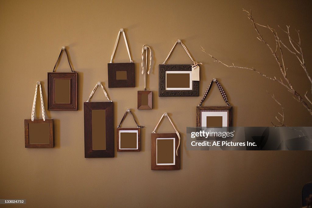 Frame Cluster Frame Cluster On Brown Wall High-Res Stock Photo - Getty Images