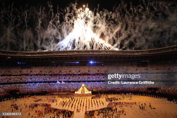 General view inside the stadium as Naomi Osaka of Team Japan lights the Olympic cauldron during the Opening Ceremony of the Tokyo 2020 Olympic Games...