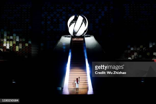 Naomi Osaka of Team Japan carries the Olympic torch during the Opening Ceremony of the Tokyo 2020 Olympic Games at Olympic Stadium on July 23, 2021...