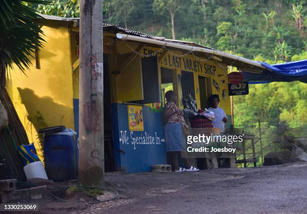 jamaican women socializing in morning - jamaicansk stock pictures, royalty-free photos & images
