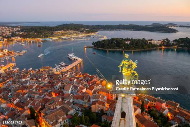 aerial drone view to rovinj old town and church of st. euphemia, popular travel destination in croatia. - rovinj stock pictures, royalty-free photos & images