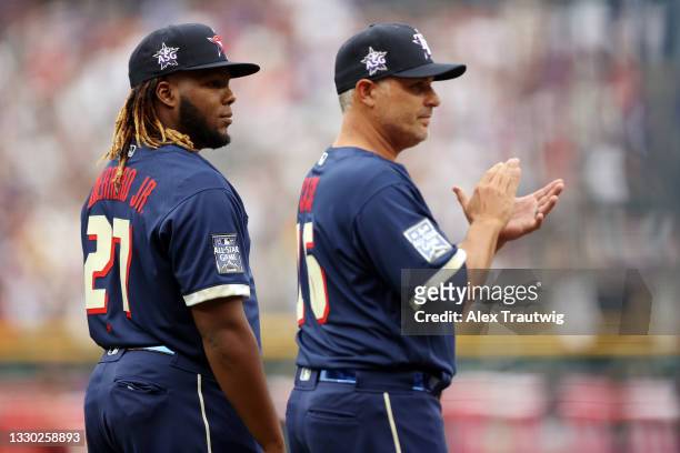 Vladimir Guerrero Jr. #27 of the Toronto Blue Jays and American League manager Kevin Cash of the Tampa Bay Rays look on during the 91st MLB All-Star...