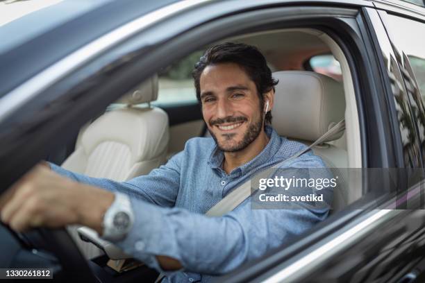 young man in car - business man driving stock pictures, royalty-free photos & images