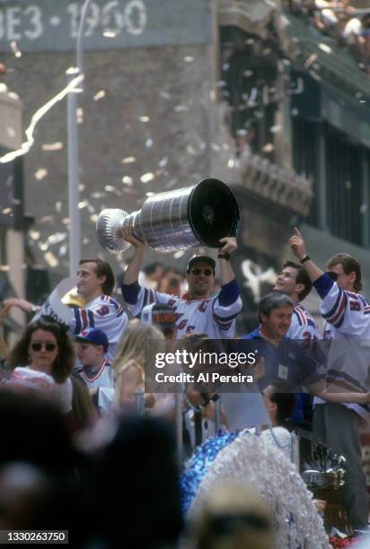 Mark Messier of the New York Rangers holds the Stanley Cup during the Rangers Stanley Cup Ticker Tape Parade on June 17, 1994 after defeating the...