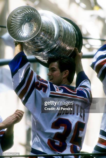 Mike Richter of the New York Rangers holds the Stanley Cup Trophy during the Rangers Stanley Cup Ticker Tape Parade on June 17, 1994 after defeating...