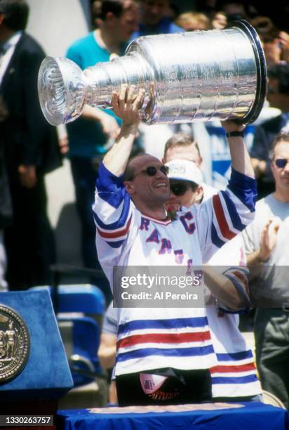 Mark Messier of the New York Rangers holds the Stanley Cup Trophy at City Hall after the Rangers Stanley Cup Ticker Tape Parade on June 17, 1994...