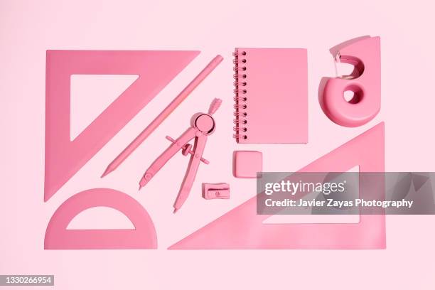 arrangement of pink stationery on pink background - ruler fotografías e imágenes de stock