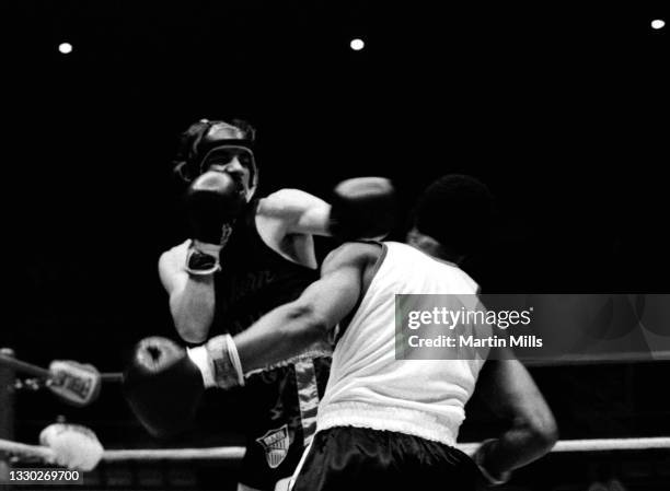 Amateur boxer Gary Griffin of the United States punches amateur boxer Bobby Lee Hunter of the United States during their light flyweight match on...