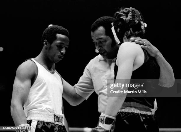 The referee goes over the rules with Amateur boxer Bobby Lee Hunter of the United States and amateur boxer Gary Griffin of the United States before...