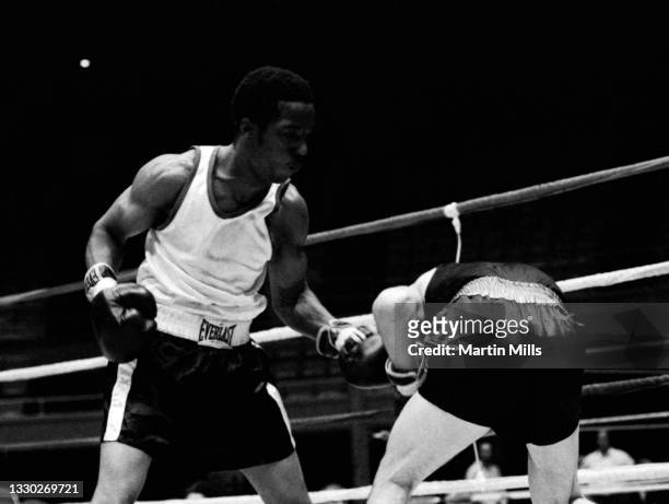 Amateur boxer Bobby Lee Hunter of the United States punches amateur boxer Gary Griffin of the United States during their light flyweight match on...