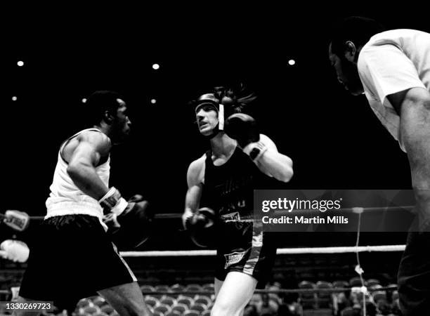 Amateur boxer Gary Griffin of the United States fights amateur boxer Bobby Lee Hunter of the United States during their light flyweight match on...