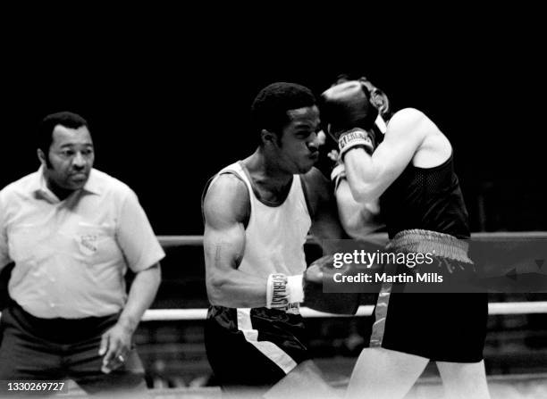 Amateur boxer Bobby Lee Hunter of the United States punches amateur boxer Gary Griffin of the United States during their light flyweight match on...