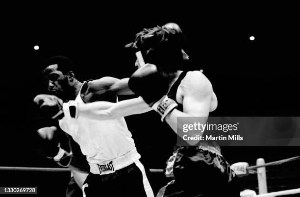 Amateur boxer Bobby Lee Hunter of the United States punches amateur boxer Gary Griffin of the United States during their light flyweight match on...