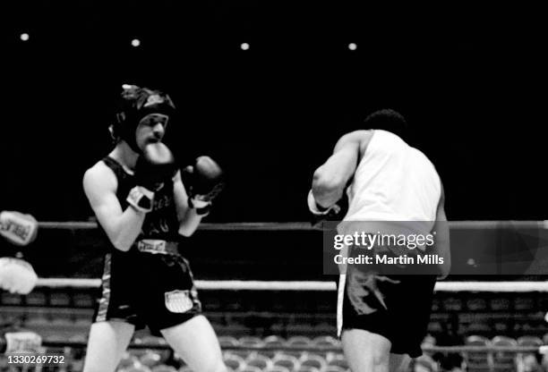 Amateur boxer Gary Griffin of the United States fights amateur boxer Bobby Lee Hunter of the United States during their light flyweight match on...