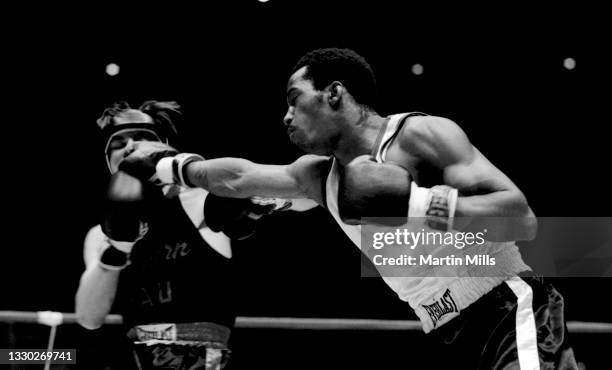 Amateur boxer Bobby Lee Hunter of the United States punches amateur boxer Gary Griffin of the United States during their light flyweight match on...