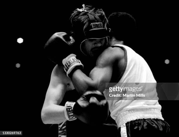 Amateur boxer Gary Griffin of the United States hugs amateur boxer Bobby Lee Hunter of the United States during their light flyweight match on April...