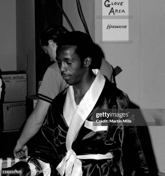 Amateur boxer Bobby Lee Hunter of the United States gets his gloves checked before his light flyweight match against amateur boxer Gary Griffin of...