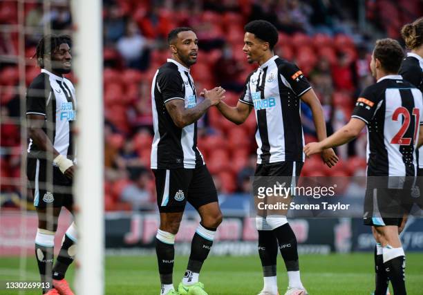 Callum Wilson of Newcastle United celebrates with Jamal Lewis after scoring the third goal during the Pre Season Friendly between Doncaster Rovers...