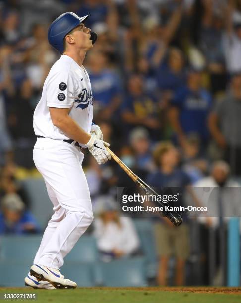 Will Smith of the Los Angeles Dodgers watches the ball clear the wall after he hit a walk off three run home run in the ninth inning of the game...