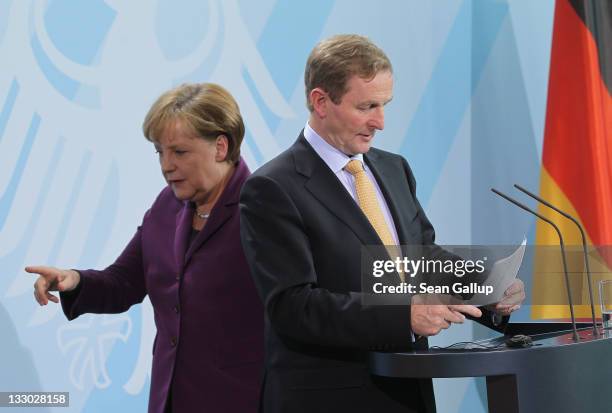Irish Prime Minister Enda Kenny and German Chancellor Angela Merkel depart after speaking to the media following talks at the Chancellery on November...