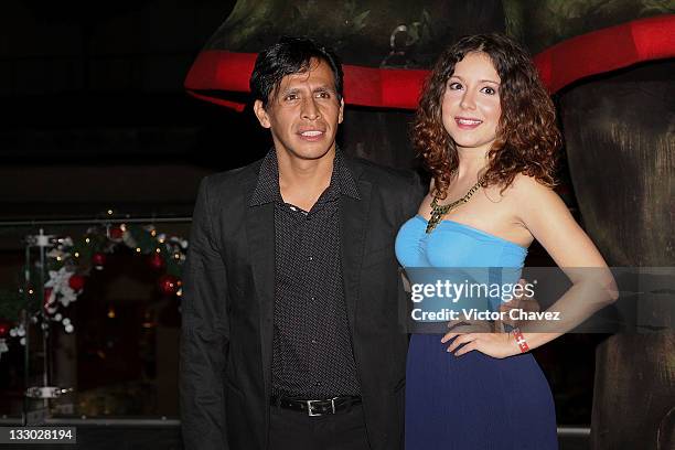 Actor Gerardo Taracena and guest walk the red carpet for the "Puss in Boots " Mexico City premiere at the Cinemex Antara Polanco on November 15, 2011...