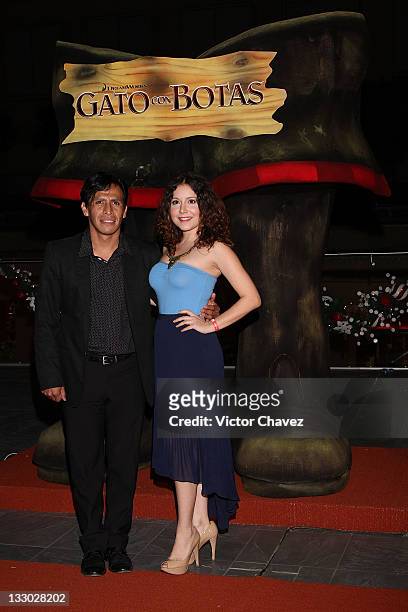Actor Gerardo Taracena and guest walk the red carpet for the "Puss in Boots " Mexico City premiere at the Cinemex Antara Polanco on November 15, 2011...