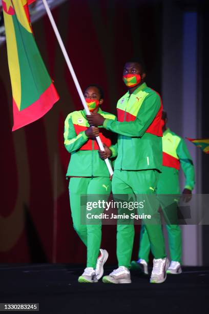 Flag bearers Kimberly Ince and Delron Felix of Team Grenada carry the flag during the Opening Ceremony of the Tokyo 2020 Olympic Games at Olympic...