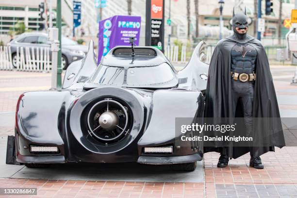 Cosplayer Auri Aminpour as Batman poses next to his Batmobile at Opening Ceremonies for the San Diego Causeplayer Community Shrine at San Diego...