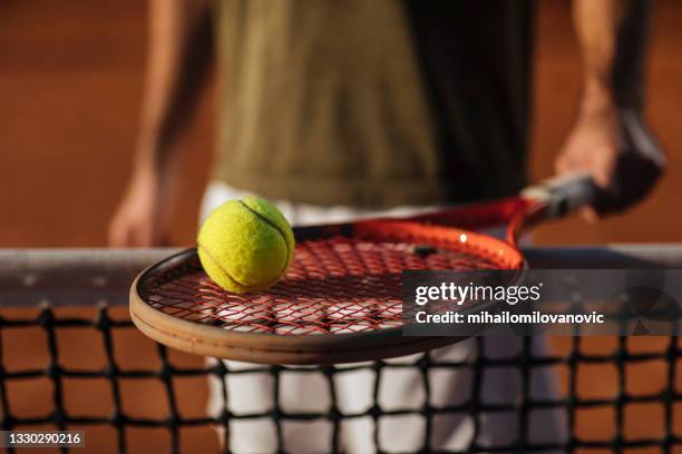 the ball that won him the match - tennis racket imagens e fotografias de stock