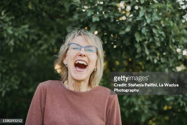senior woman enthusiastic - ecstatic face stock pictures, royalty-free photos & images