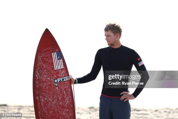 John John Florence of Team United States poses ahead of a training session during day one of the Tokyo Olympic Games at Tsurigasaki Surfing Beach on...