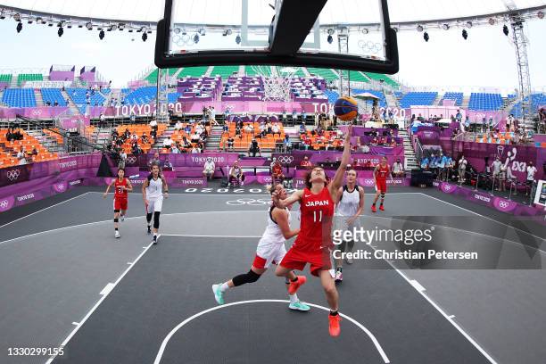 Mio Shinozaki of Team Japan drives to the basket during the Women's Pool Round match between ROC and Japan on day one of the Tokyo 2020 Olympic Games...