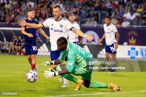 Bill Hamid of D.C. United attempts to save the ball in the game against the Chicago Fire at Soldier Field on July 21, 2021 in Chicago, Illinois.