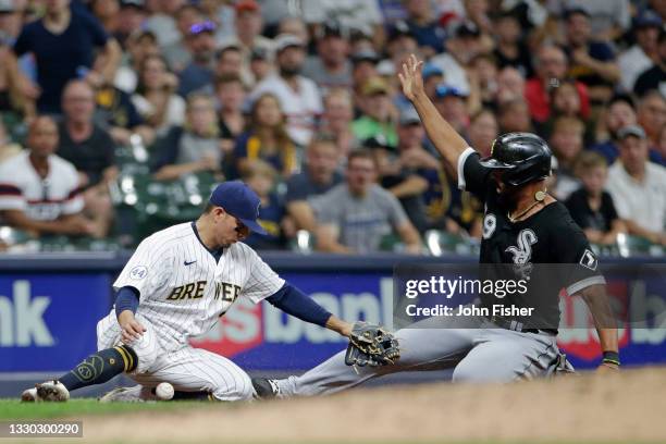 Luis Urias of the Milwaukee Brewers looses the ball while attempting to tag out a sliding Jose Abreu of the Chicago White Sox in the sixth inning at...