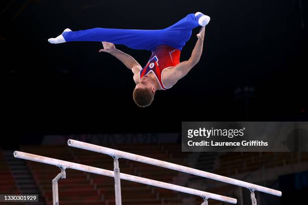 Aleksandr Kartsev of Team ROC competes on parallel bars during Men's Qualification on day one of the Tokyo 2020 Olympic Games at Ariake Gymnastics...