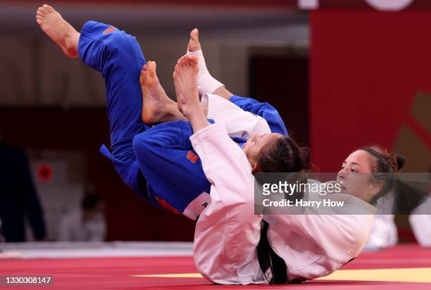 Katharina Menz of Germany and Mary Dee Vargas Ley of Chile compete during the Women’s Judo 48kg Elimination Round of 32 on day one of the Tokyo 2020...