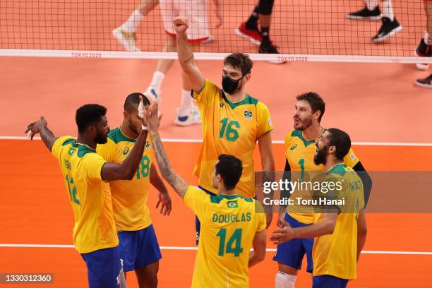 Team Brazil celebrates after a point against Team Tunisia during the Men's Preliminary Round - Pool B on day one of the Tokyo 2020 Olympic Games at...