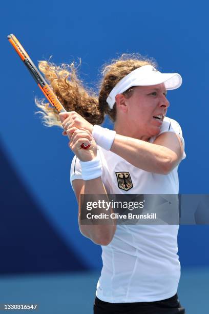 Anna-Lena Friedsam of Team Germany plays a backhand during her Women's Singles First Round match against Heather Watson of Team Great Britain on day...