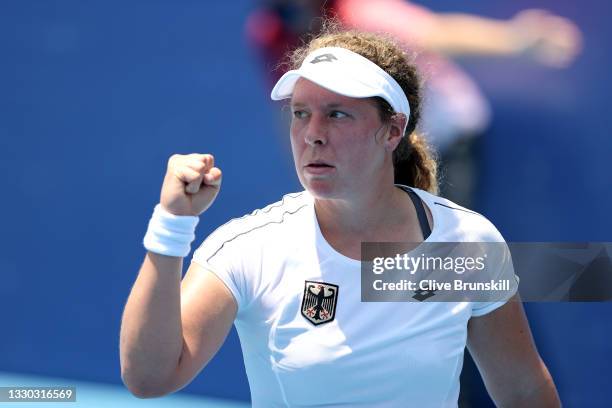 Anna-Lena Friedsam of Team Germany celebrates winning the first set during her Women's Singles First Round match against Heather Watson of Team Great...