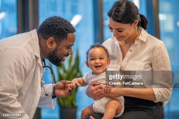 cute baby at the doctor's office - doctor and baby stock pictures, royalty-free photos & images