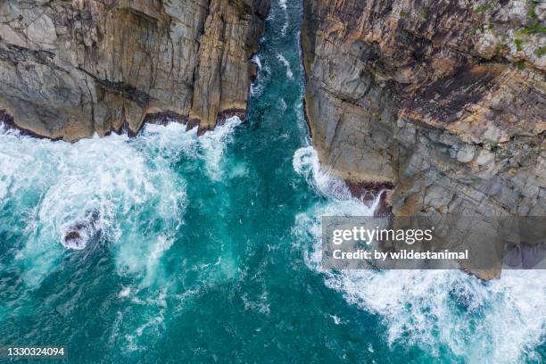 aerial view of sea cliffs and the ocean, central coast, nsw, australia. - tide rivers stock pictures, royalty-free photos & images