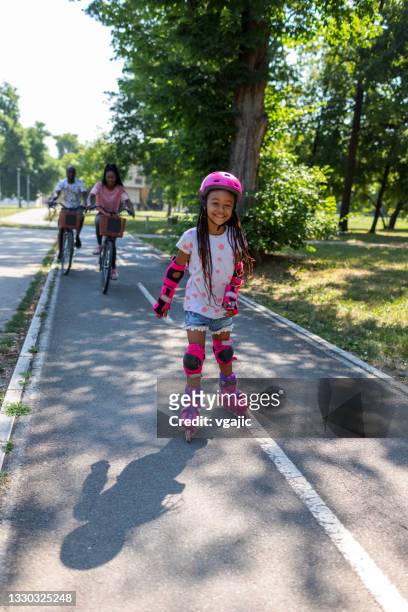 girl roller skating - girl roller skates stock pictures, royalty-free photos & images